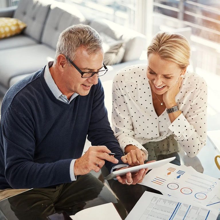 Elderly Couple looking at documents